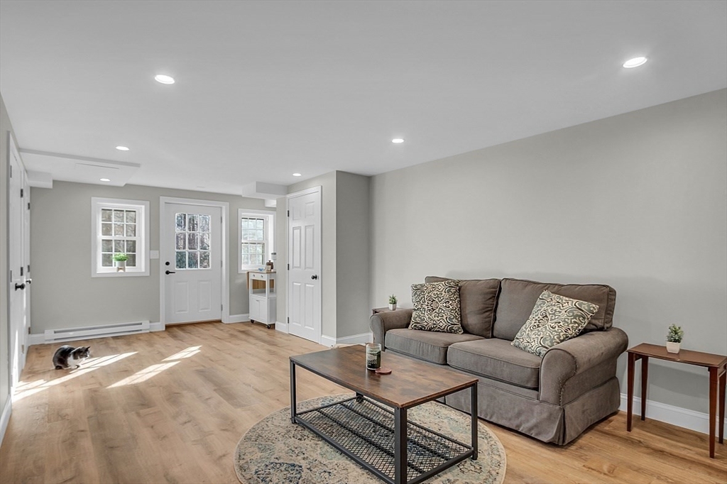 114 Bailey Road Andover, MA 01810 - Photo 33 of 42 a living room with furniture and wooden floor