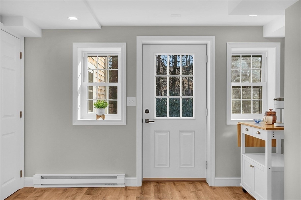 114 Bailey Road Andover, MA 01810 - Photo 34 of 42 an entryway with wooden floor and windows