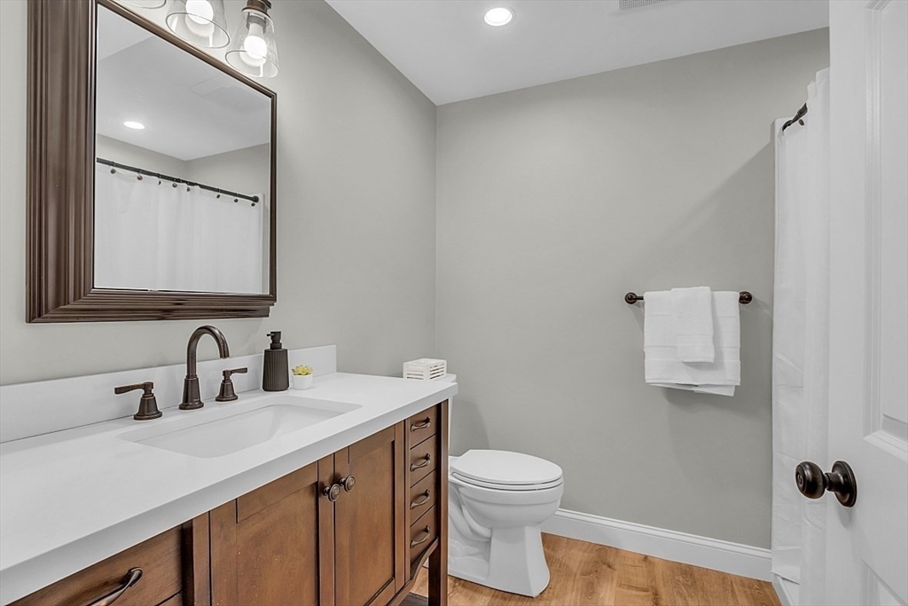 114 Bailey Road Andover, MA 01810 - Photo 35 of 42 a bathroom with a toilet sink and mirror