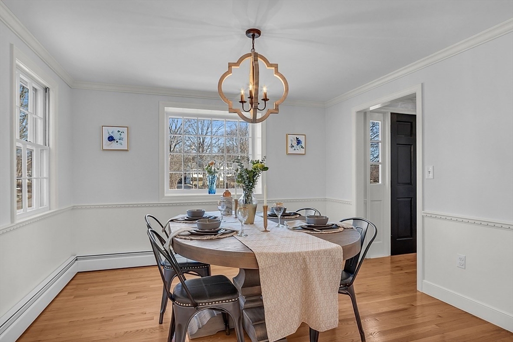 114 Bailey Road Andover, MA 01810 - Photo 7 of 42 a view of a dining room with furniture window and wooden floor