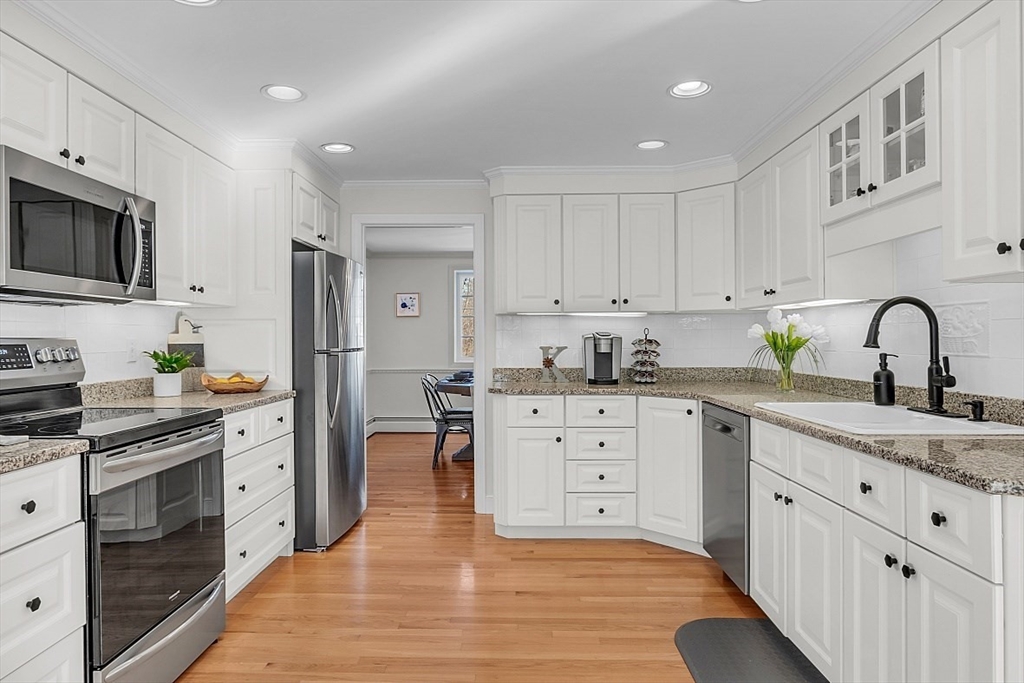 114 Bailey Road Andover, MA 01810 - Photo 9 of 42 a kitchen with white cabinets stainless steel appliances and sink
