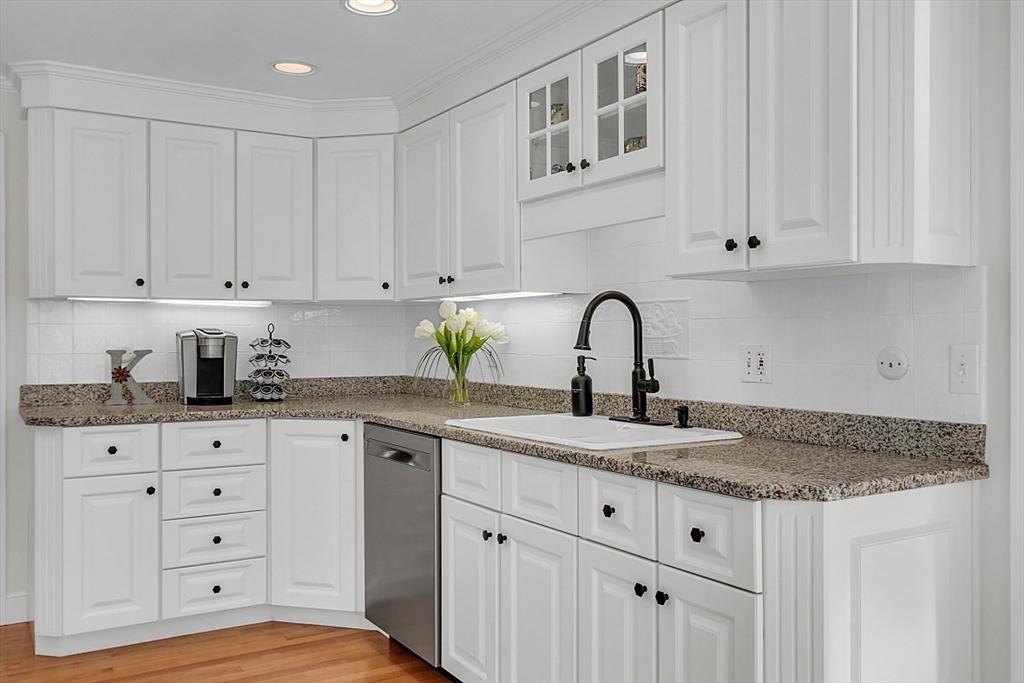 114 Bailey Road Andover, MA 01810 - Photo 10 of 42 a kitchen with granite countertop white cabinets and sink