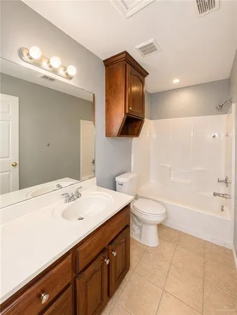 a bathroom with a sink a toilet and bathtub