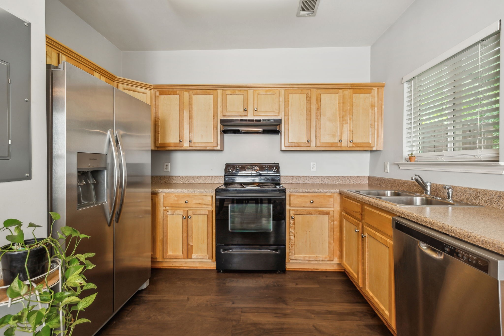 3535 Bell Road, Unit 301 Nashville, TN 37214 - Photo 16 of 47 a kitchen with stainless steel appliances granite countertop a stove a sink and a refrigerator