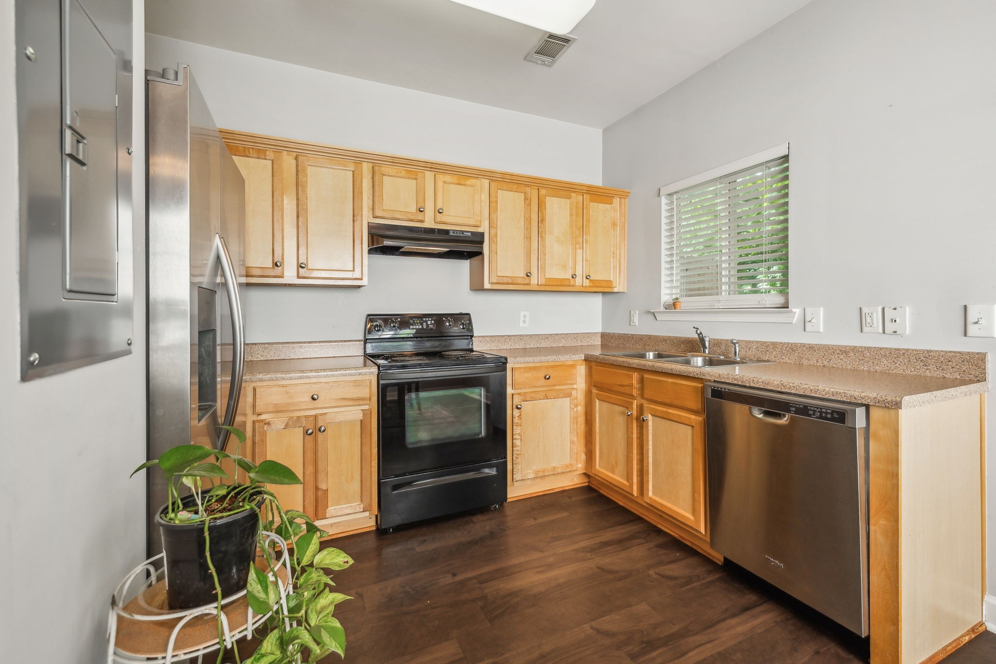 3535 Bell Road, Unit 301 Nashville, TN 37214 - Photo 17 of 47 a kitchen with stainless steel appliances kitchen island granite countertop a stove a sink and a refrigerator