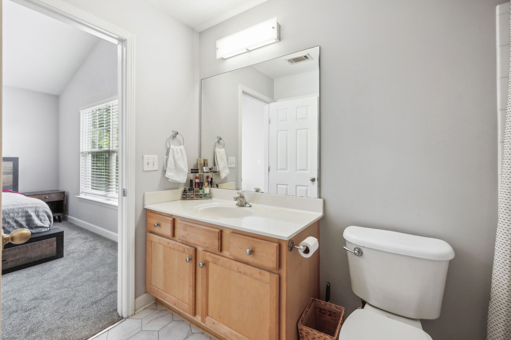 3535 Bell Road, Unit 301 Nashville, TN 37214 - Photo 30 of 47 a bathroom with a toilet sink and mirror