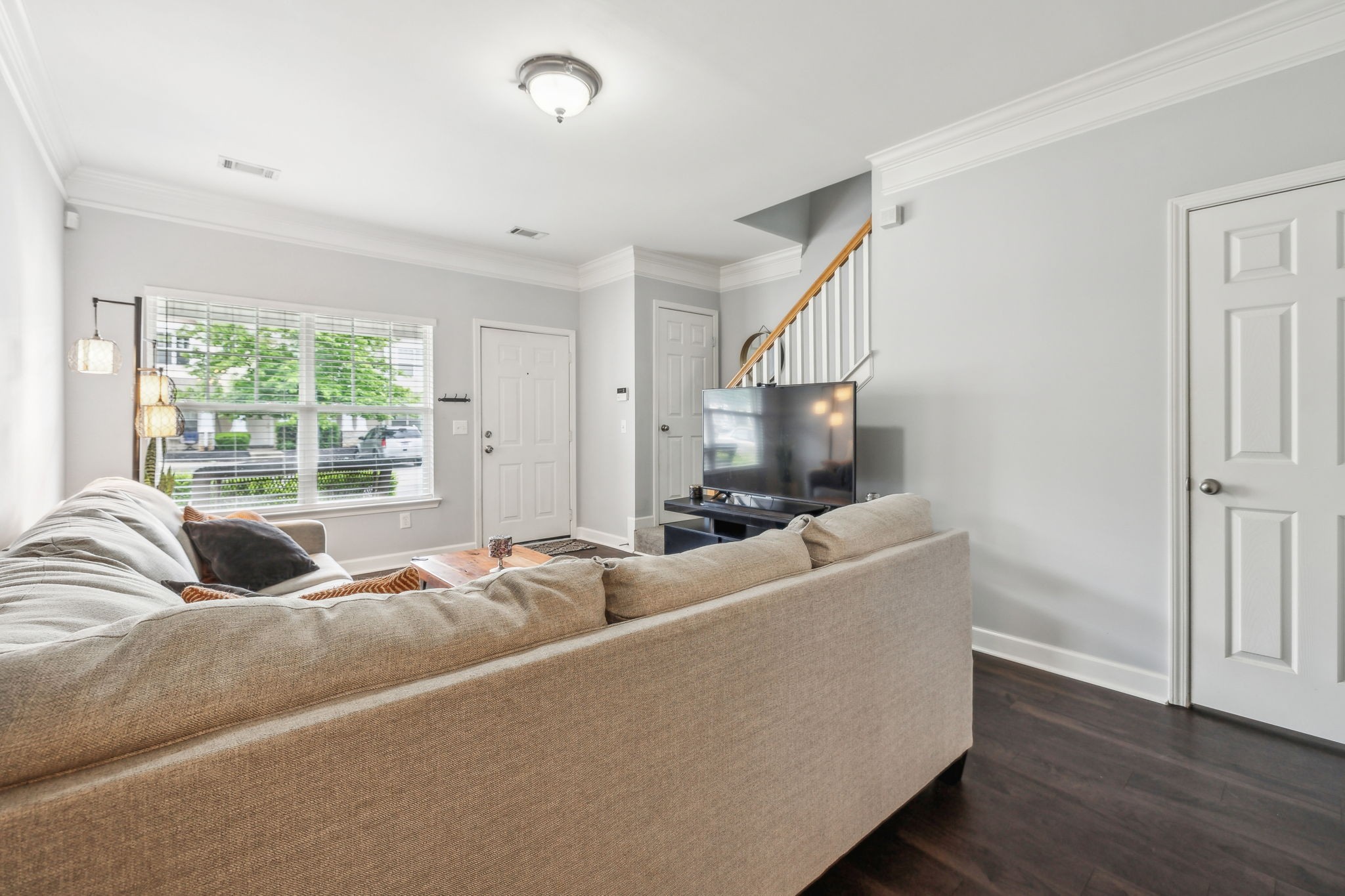 3535 Bell Road, Unit 301 Nashville, TN 37214 - Photo 8 of 47 a living room with furniture and a flat screen tv