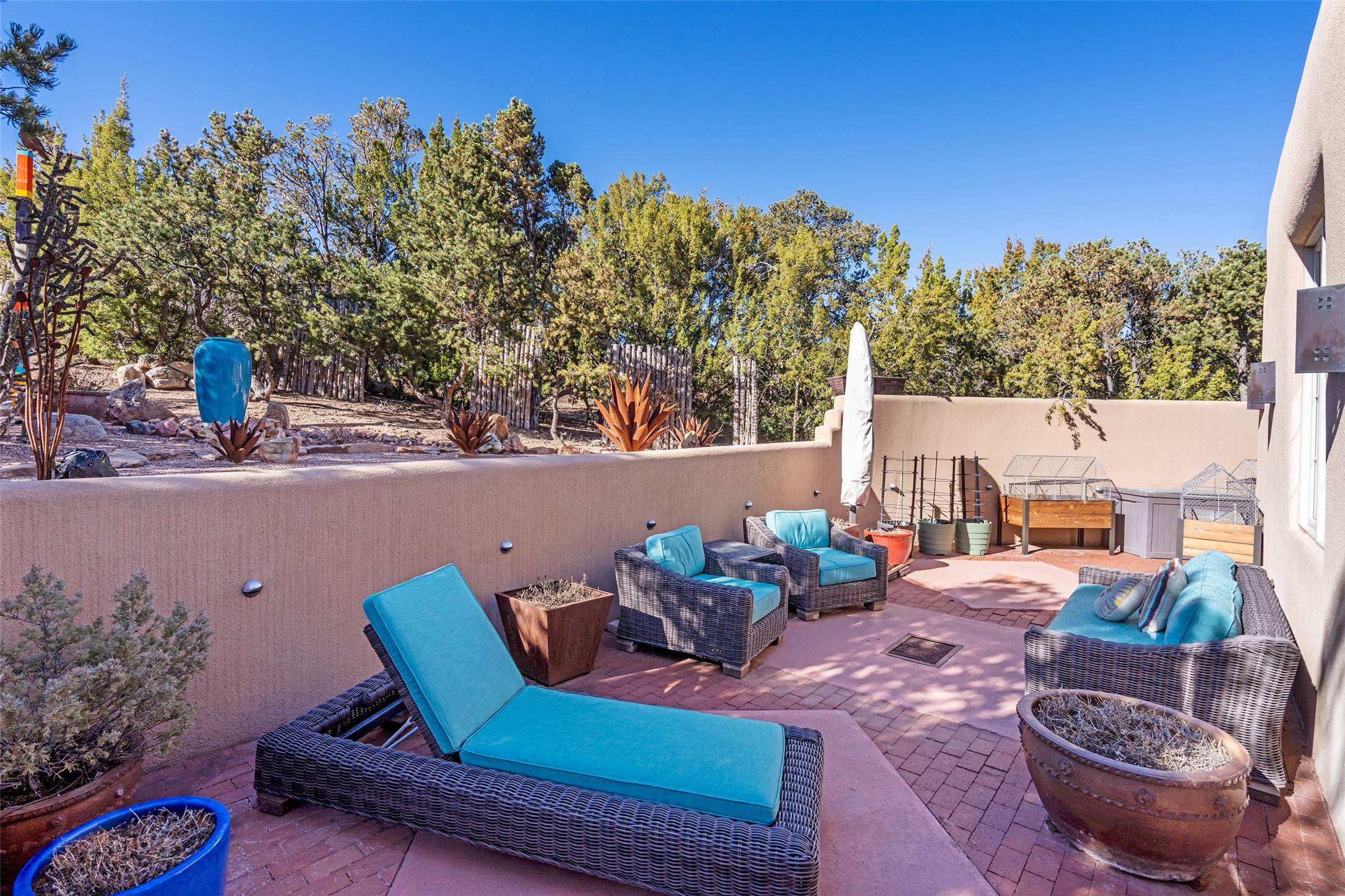 1204 Bandolina Road Santa Fe, NM 87501 - Photo 4 of 69 Side patio / outdoor lounge; raised garden beds convey with property