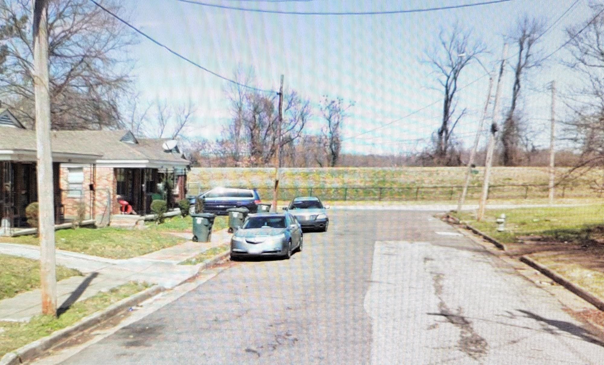 1618 Davis Street Memphis, TN 38108 - Photo 2 of 3 View of asphalt road with curbs and sidewalks
