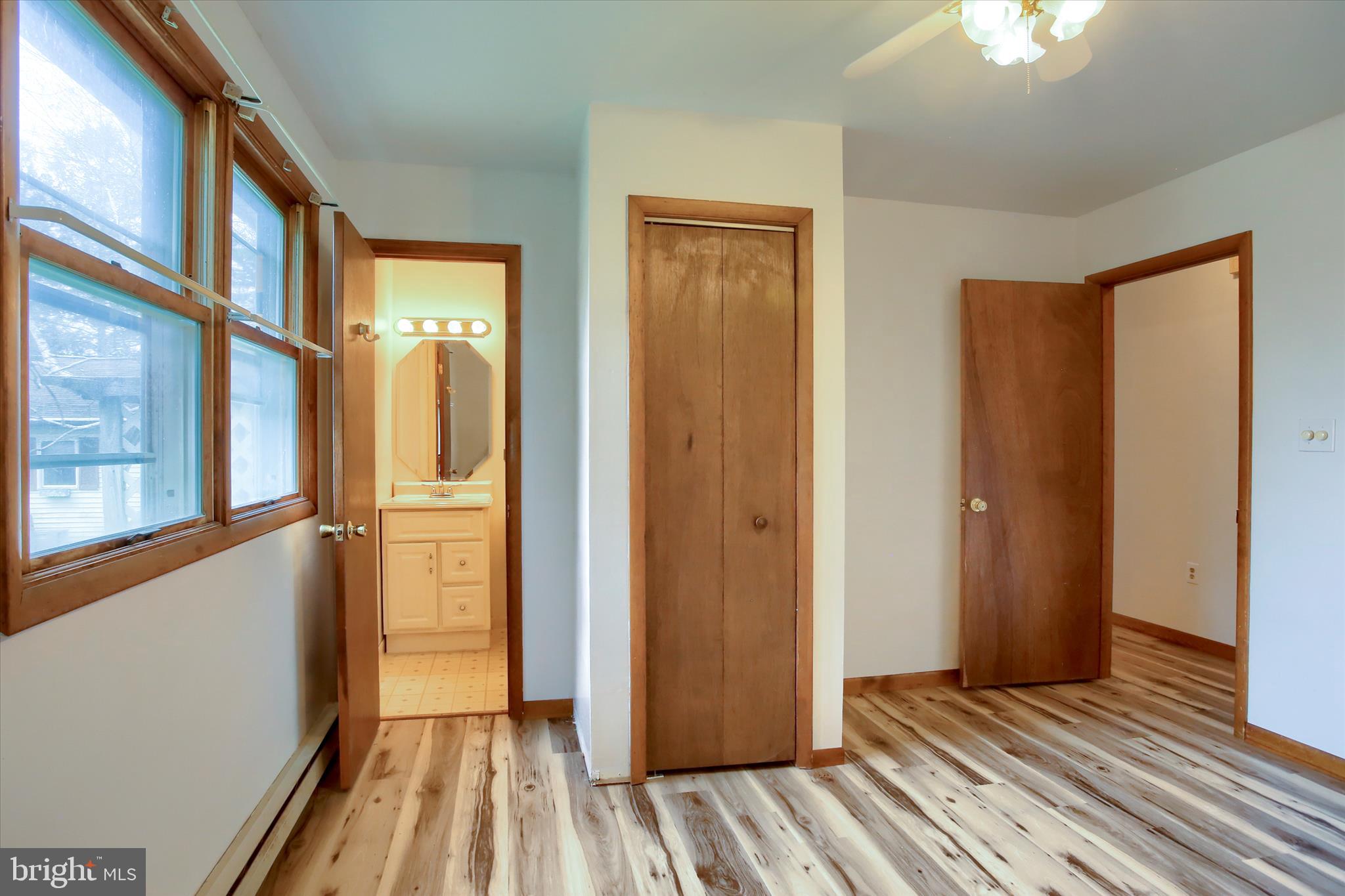 1916 Fisher Road Mechanicsburg, PA 17055 - Photo 14 of 31 a view of a room with wooden floor and a bathroom