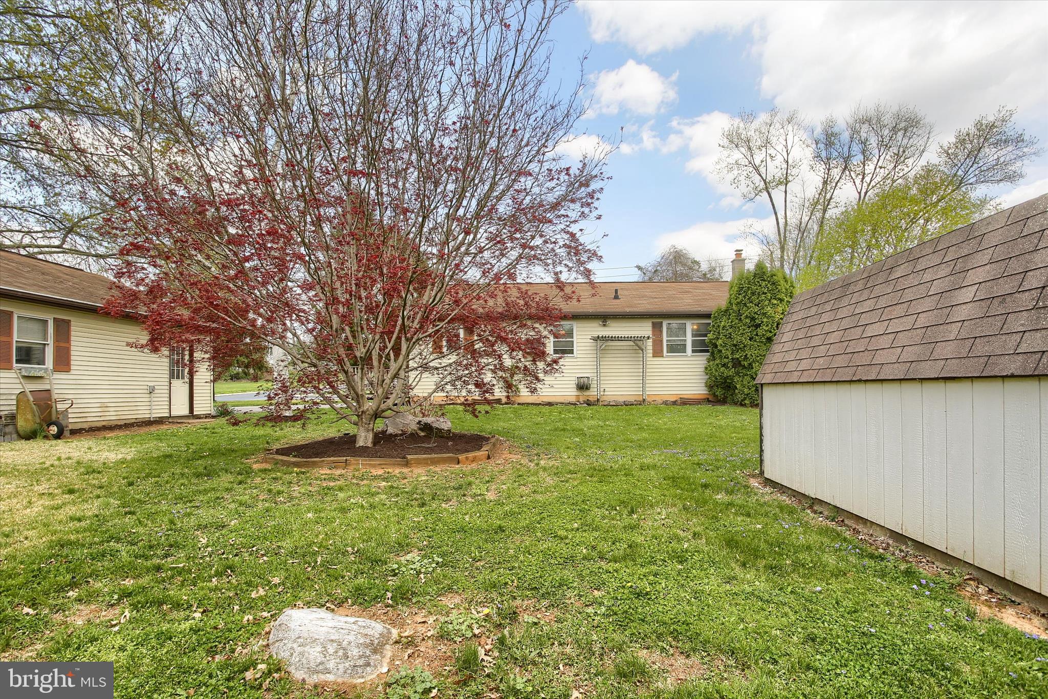 1916 Fisher Road Mechanicsburg, PA 17055 - Photo 29 of 31 a backyard of a house with plants and large tree