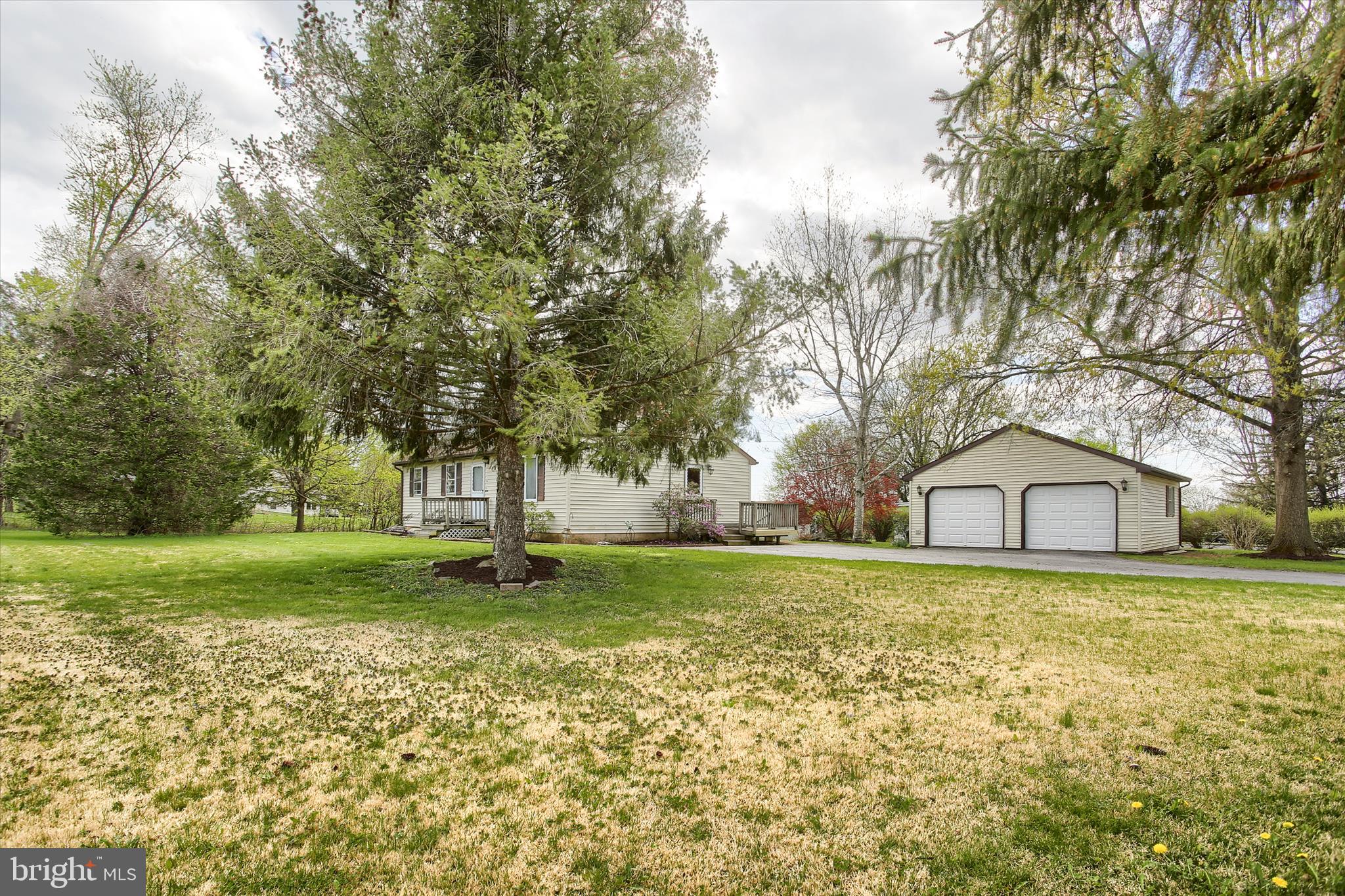 1916 Fisher Road Mechanicsburg, PA 17055 - Photo 4 of 31 a white house covered with tall trees