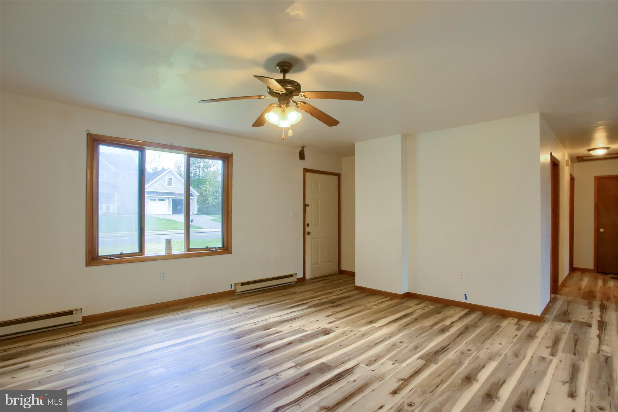1916 Fisher Road Mechanicsburg, PA 17055 - Photo 7 of 31 a view of empty room with wooden floor and fan