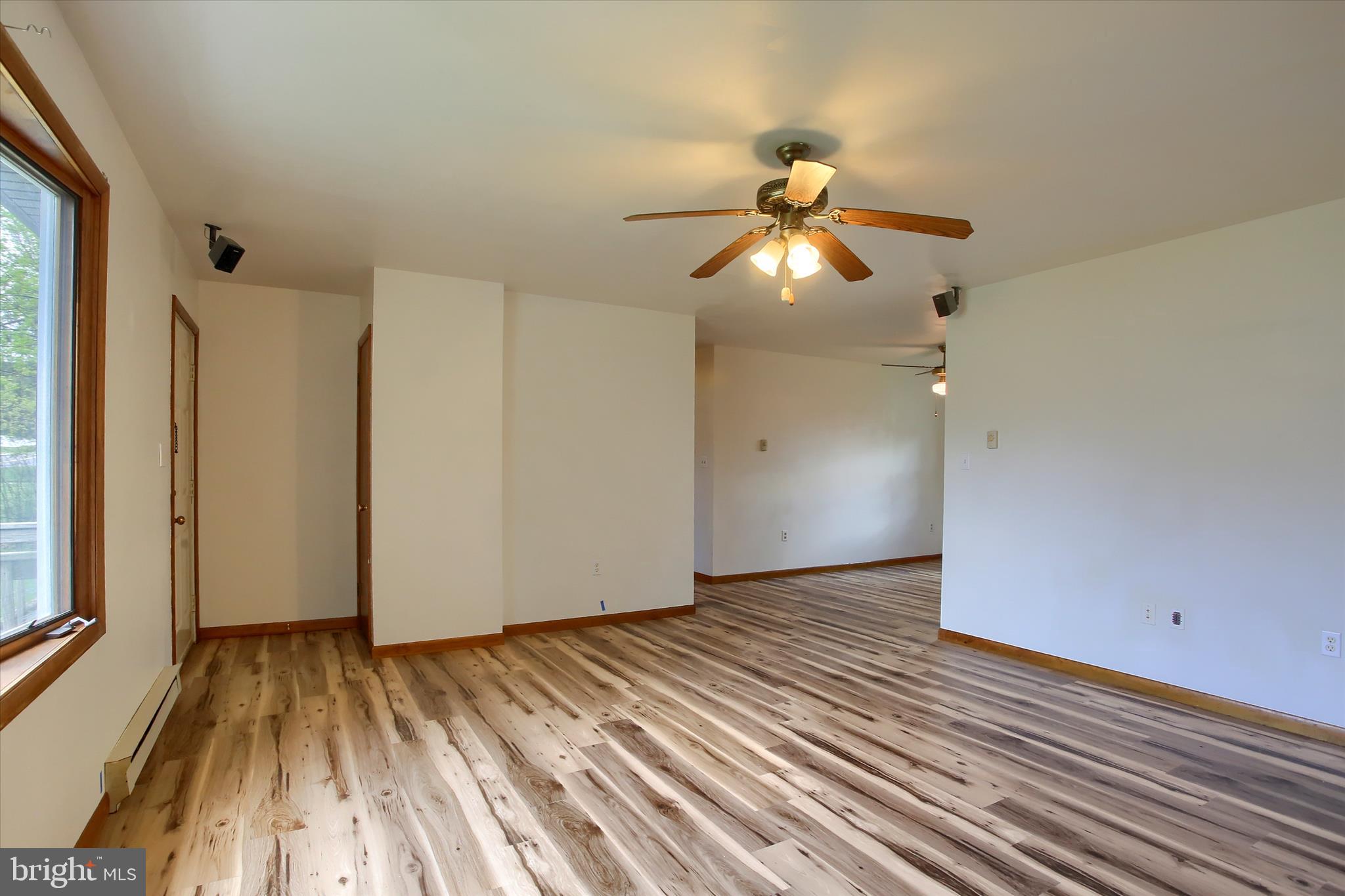 1916 Fisher Road Mechanicsburg, PA 17055 - Photo 8 of 31 a view of empty room with wooden floor and fan