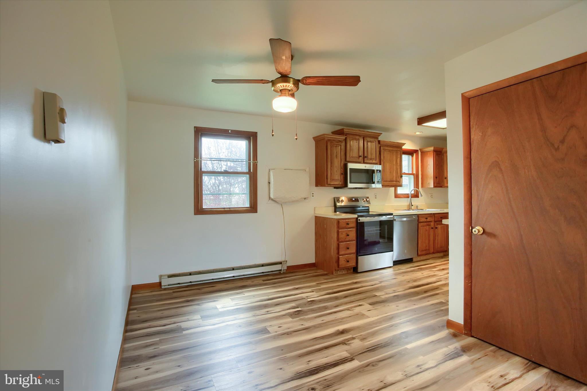 1916 Fisher Road Mechanicsburg, PA 17055 - Photo 9 of 31 a kitchen with stainless steel appliances granite countertop a refrigerator and a stove top oven