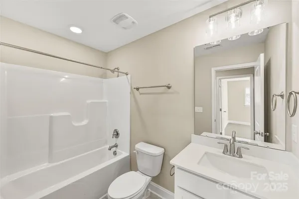a bathroom with a sink toilet tub and shower
