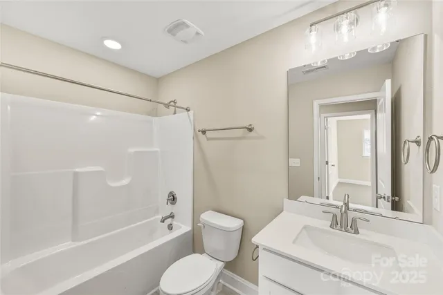 a bathroom with a sink toilet tub and shower