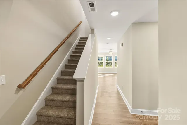 a view of entryway with wooden floor