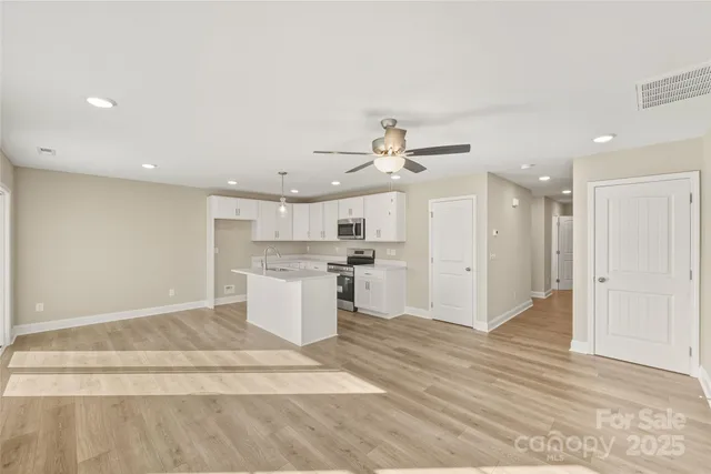 a view of kitchen with wooden floor