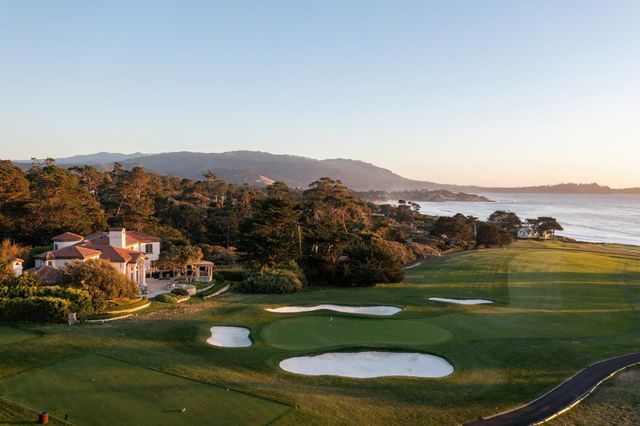 an aerial view of a houses with a yard