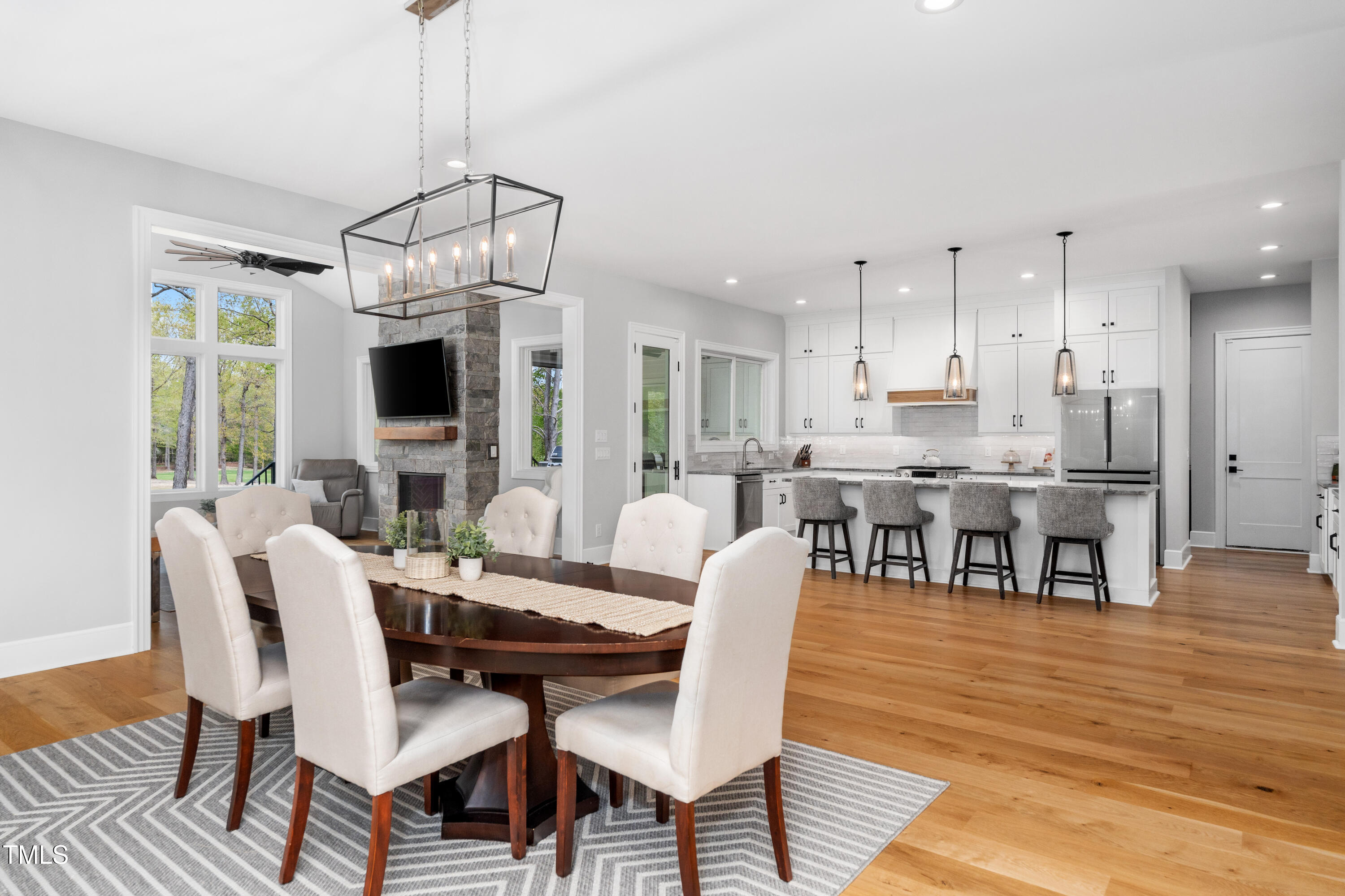 1213 Rocky Point Lane Durham, NC 27712 - Photo 14 of 76 a view of a dining room with furniture wooden floor and chandelier