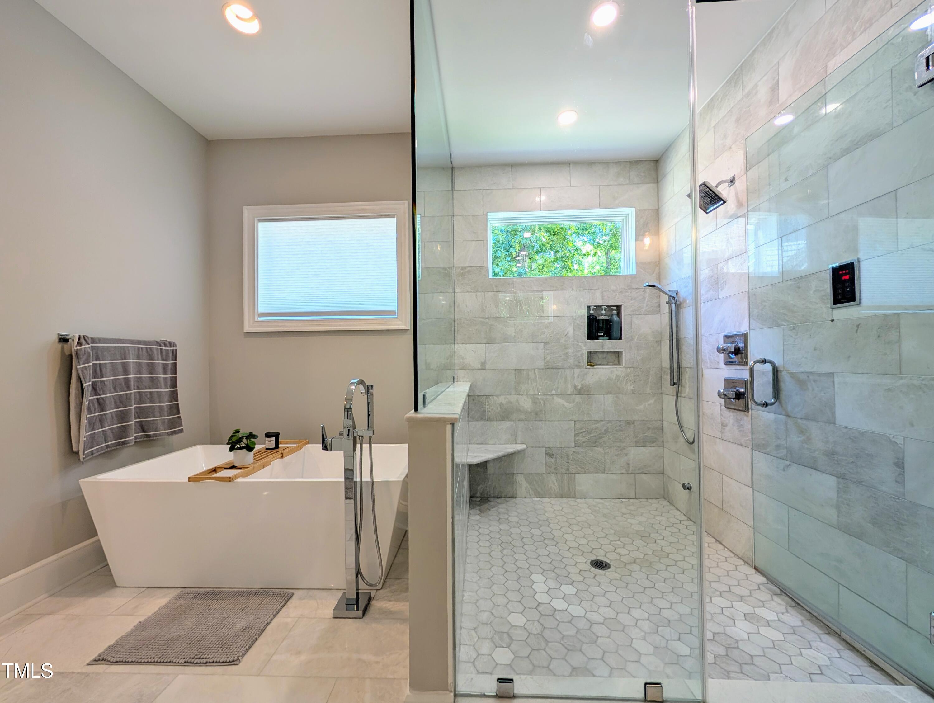 1213 Rocky Point Lane Durham, NC 27712 - Photo 25 of 76 a bathroom with a bathtub and shower