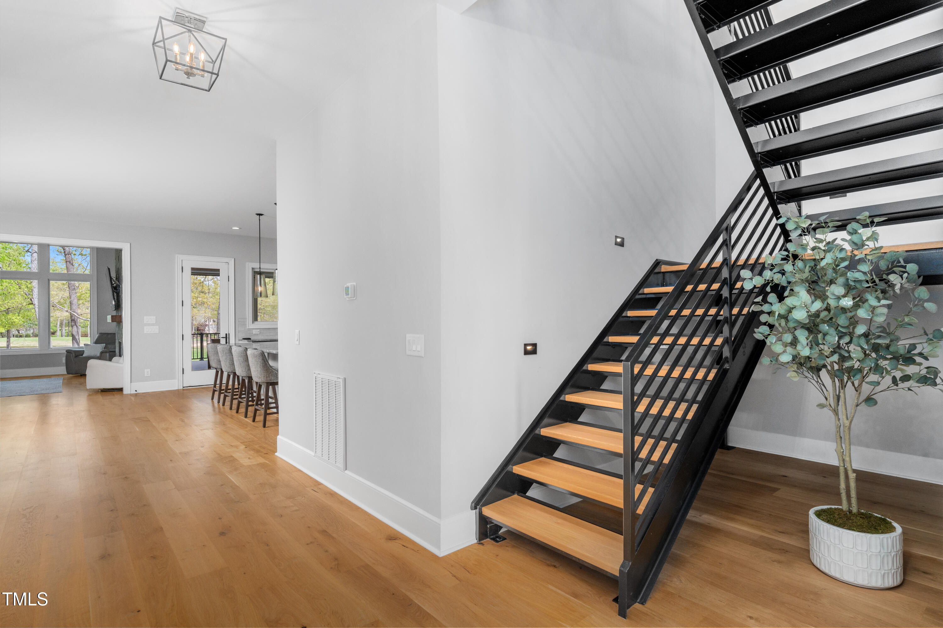 1213 Rocky Point Lane Durham, NC 27712 - Photo 33 of 76 a view of entryway and hall with wooden floor
