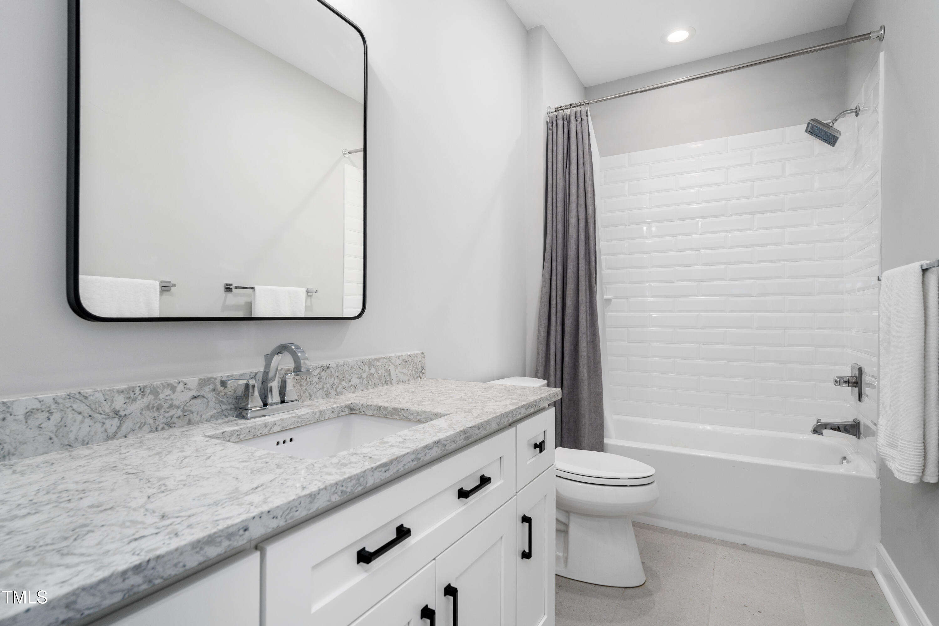 1213 Rocky Point Lane Durham, NC 27712 - Photo 52 of 76 a bathroom with a granite countertop sink toilet and shower