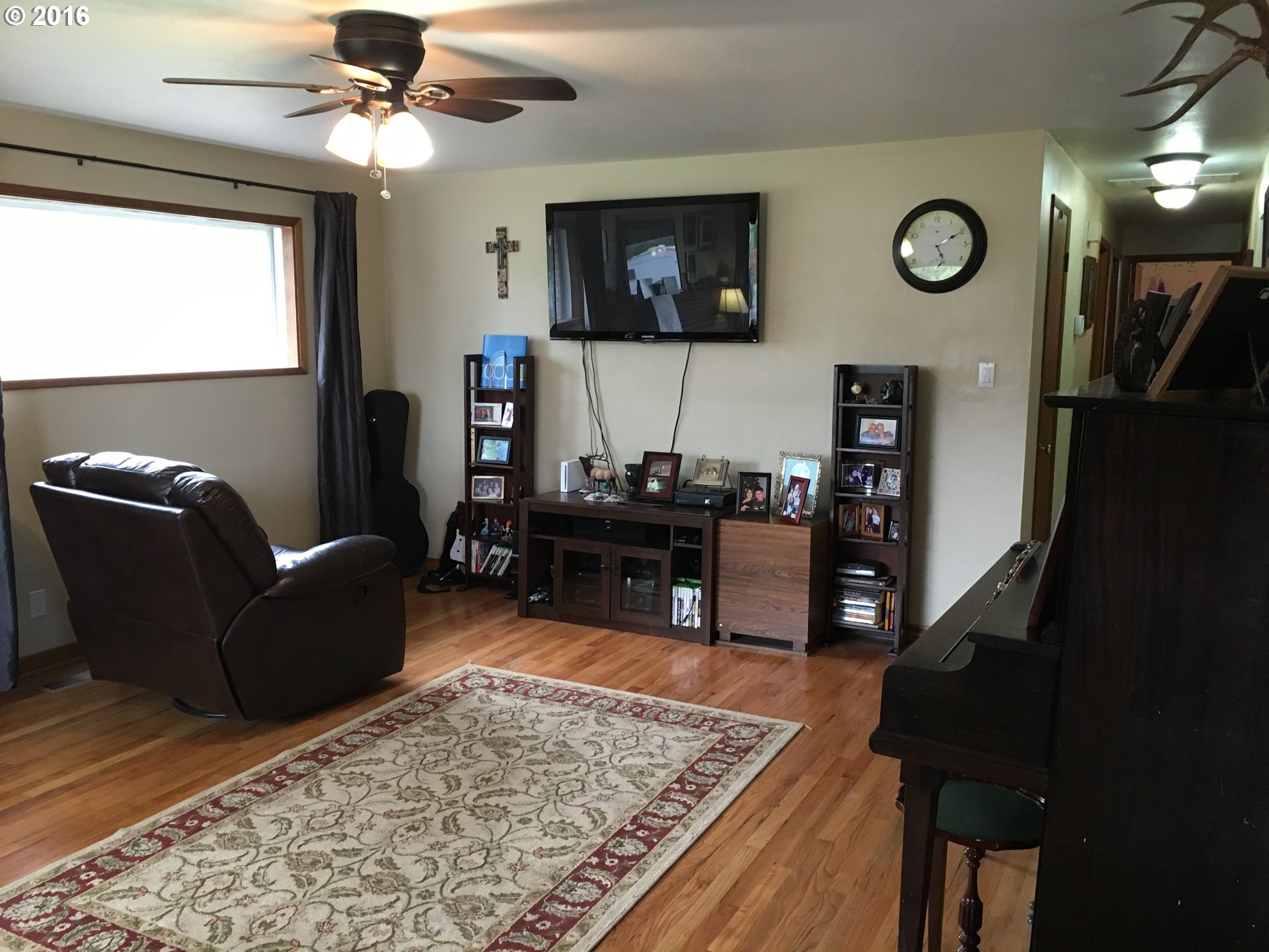 3311 Northeast Riverside Avenue Pendleton, OR 97801 - Photo 5 of 13 a living room with furniture and a flat screen tv