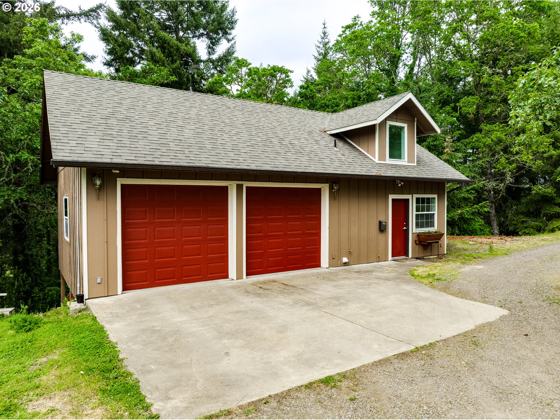 28544 Crow Road Eugene, OR 97402 - Photo 36 of 48 a front view of a house with a yard and garage