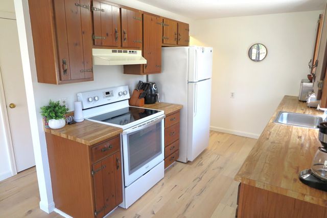 a kitchen with sink cabinets and window