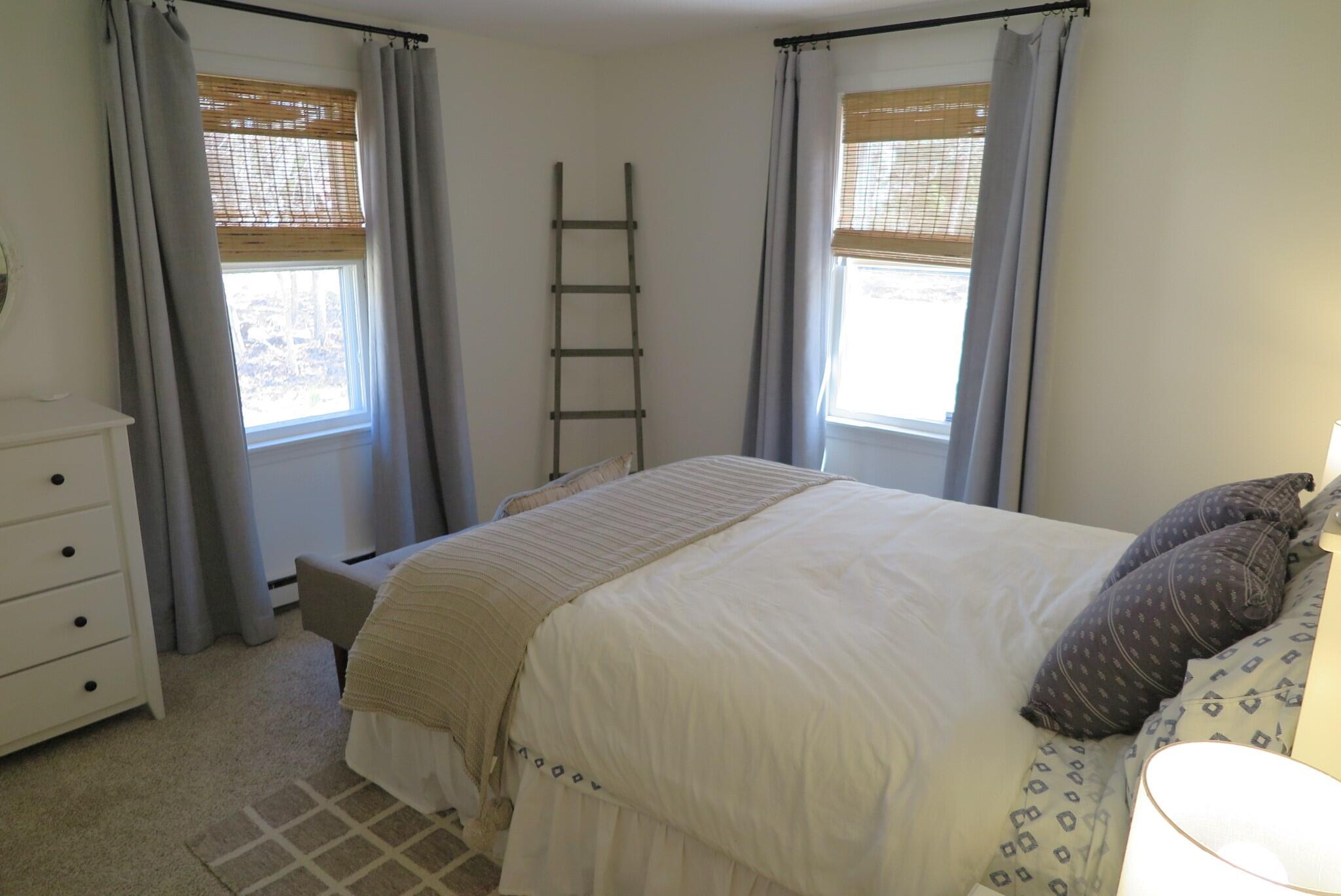 2420 Herring Brook Road Eastham, MA 02642 - Photo 12 of 37 a bedroom with a bed and a window