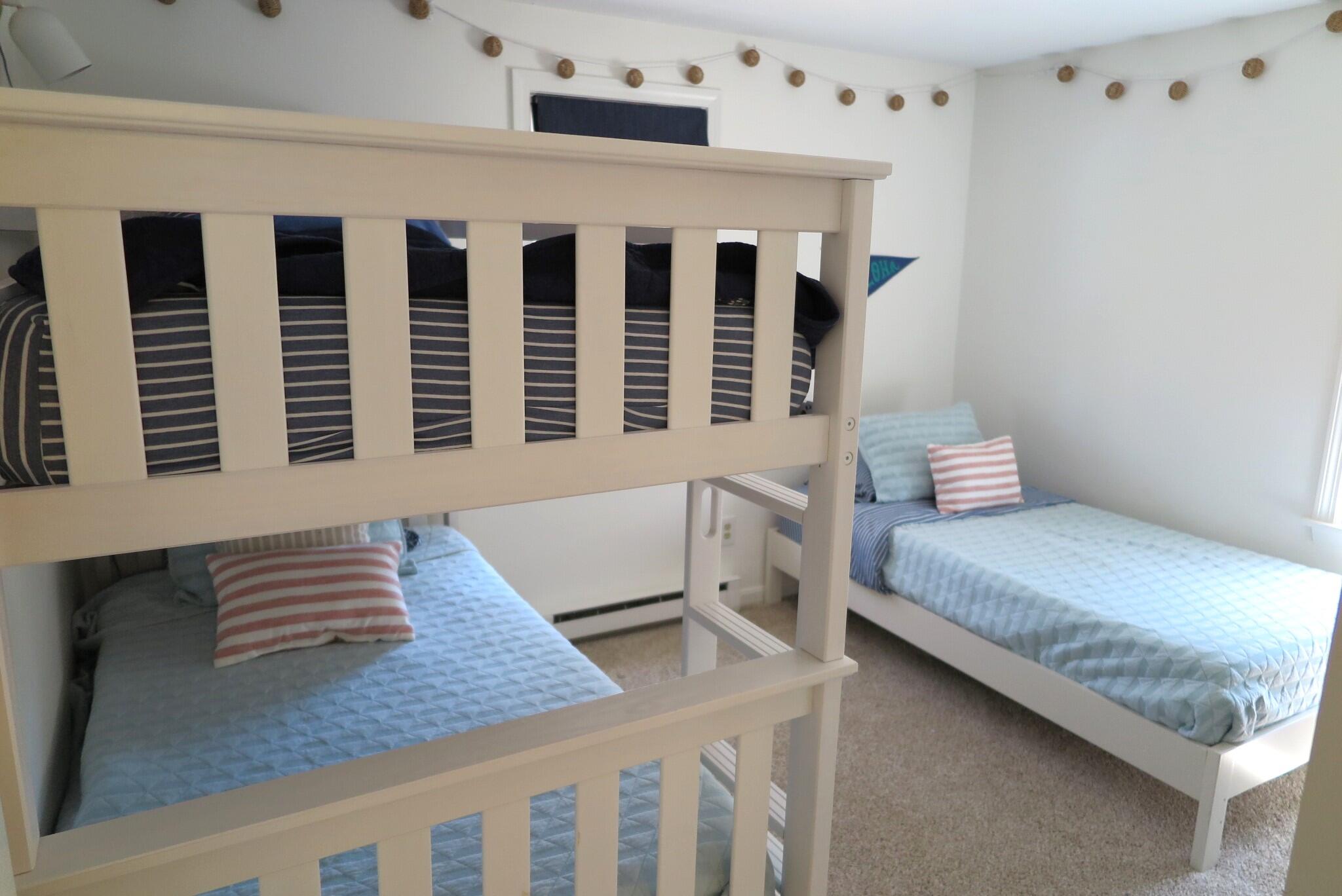 2420 Herring Brook Road Eastham, MA 02642 - Photo 17 of 37 a bedroom with a bed and wooden floor