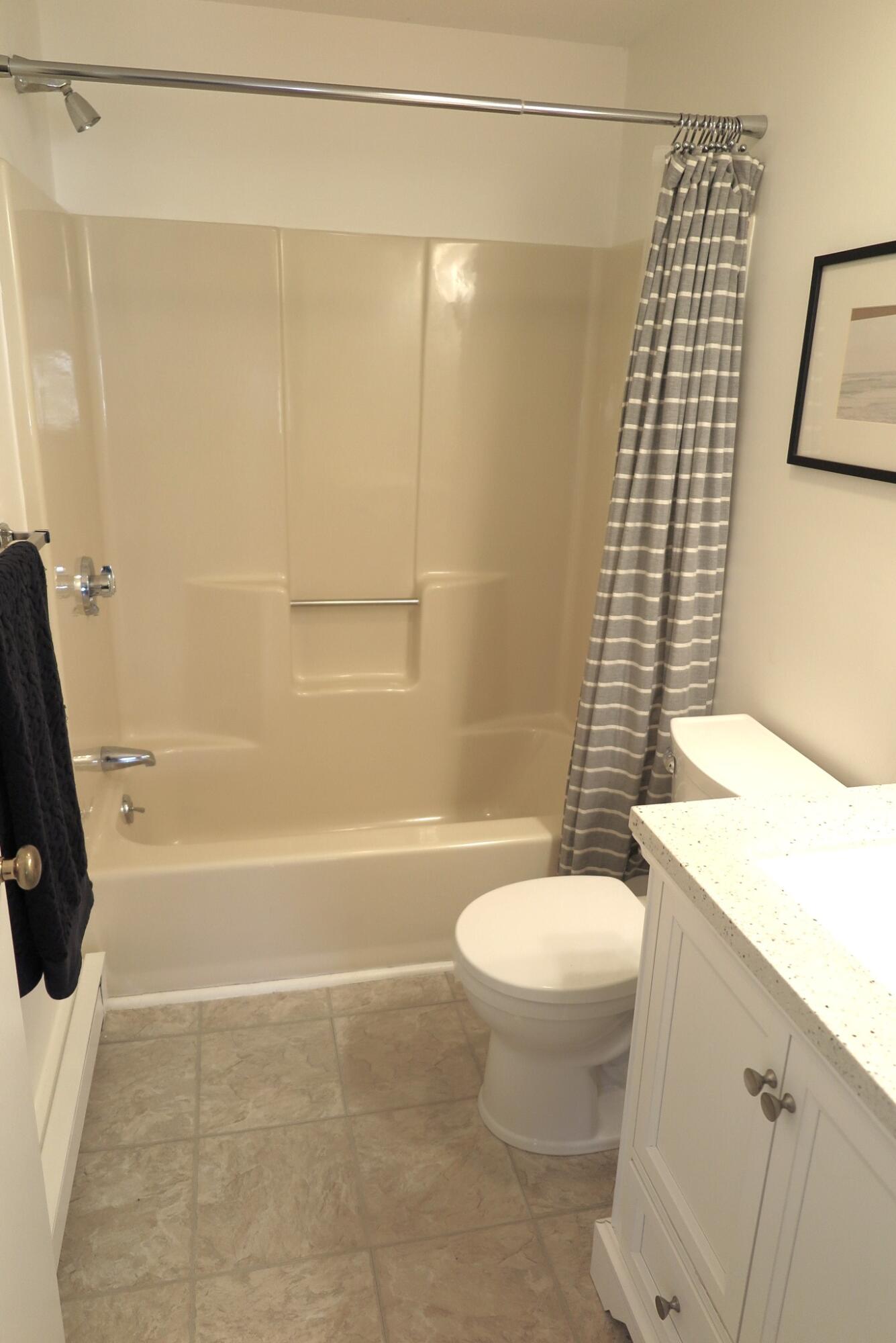 2420 Herring Brook Road Eastham, MA 02642 - Photo 19 of 37 a bathroom with a sink a toilet and shower