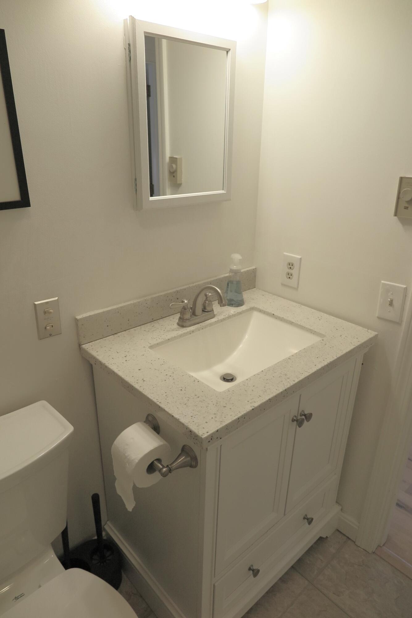 2420 Herring Brook Road Eastham, MA 02642 - Photo 20 of 37 a bathroom with a sink and a toilet