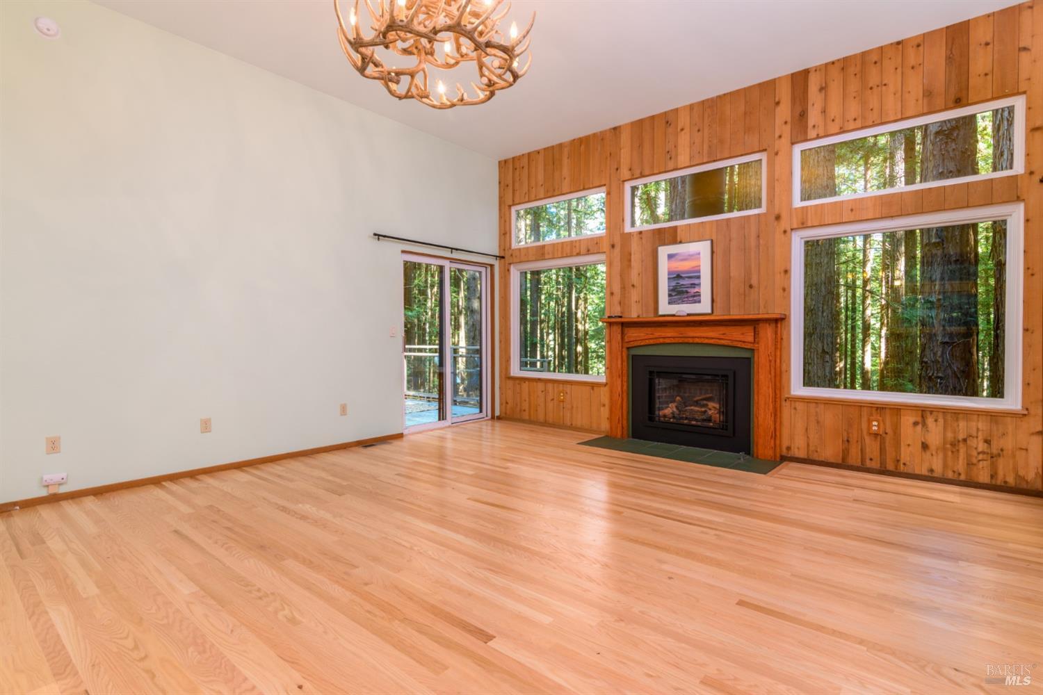 1101 River Beach Road The Sea Ranch, CA 95497 - Photo 11 of 34 a view of an empty room with a fireplace and a window