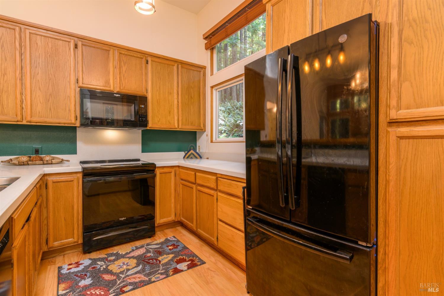 1101 River Beach Road The Sea Ranch, CA 95497 - Photo 15 of 34 a kitchen with granite countertop stainless steel appliances and counter space
