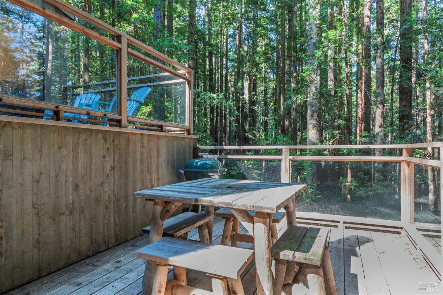 1101 River Beach Road The Sea Ranch, CA 95497 - Photo 7 of 34 a patio with wooden floor and outdoor seating