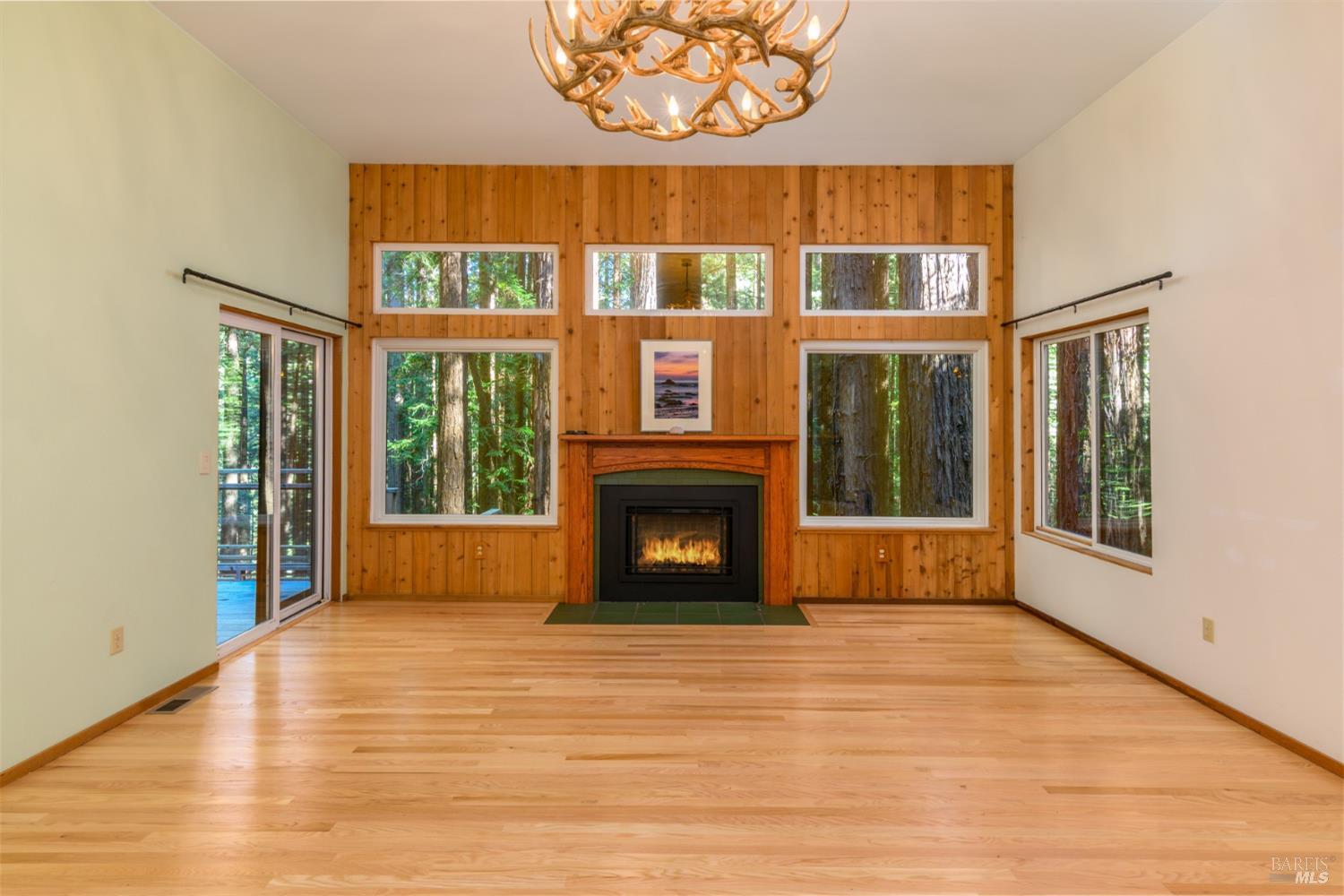 1101 River Beach Road The Sea Ranch, CA 95497 - Photo 10 of 34 a view of an empty room with glass door and wooden floor