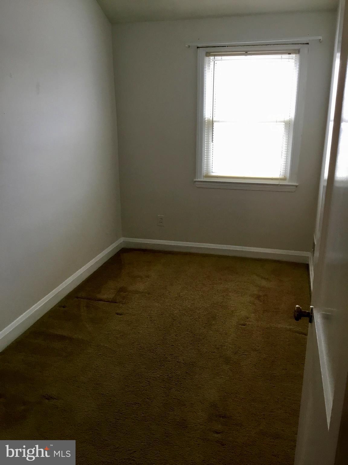 947 Arncliffe Road Baltimore, MD 21221 - Photo 14 of 20 a view of a small space with wooden floor and a window