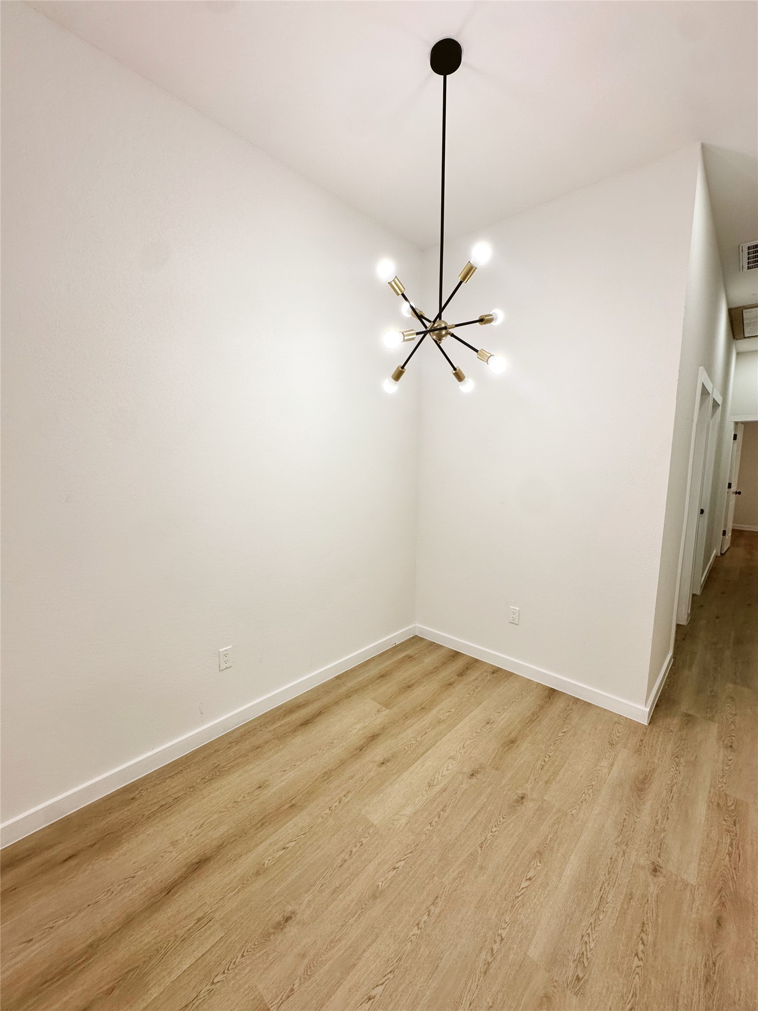 9707 Cargill Street Houston, TX 77029 - Photo 7 of 22 a view of a room with an empty space and a ceiling fan