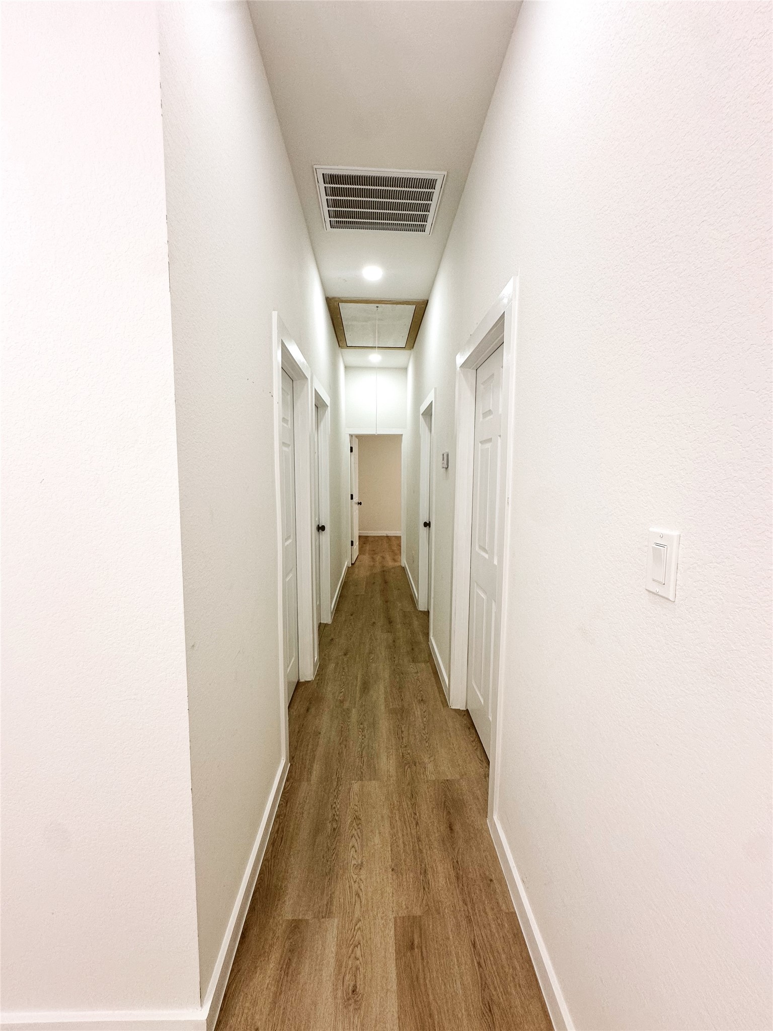 9707 Cargill Street Houston, TX 77029 - Photo 8 of 22 a view of a hallway with wooden floor