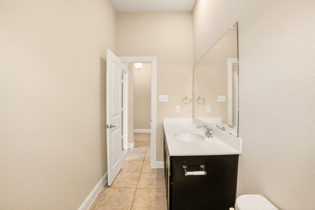 552 Winnetka Drive Oak Point, TX 75068 - Photo 9 of 40 a bathroom with a sink a toilet and shower