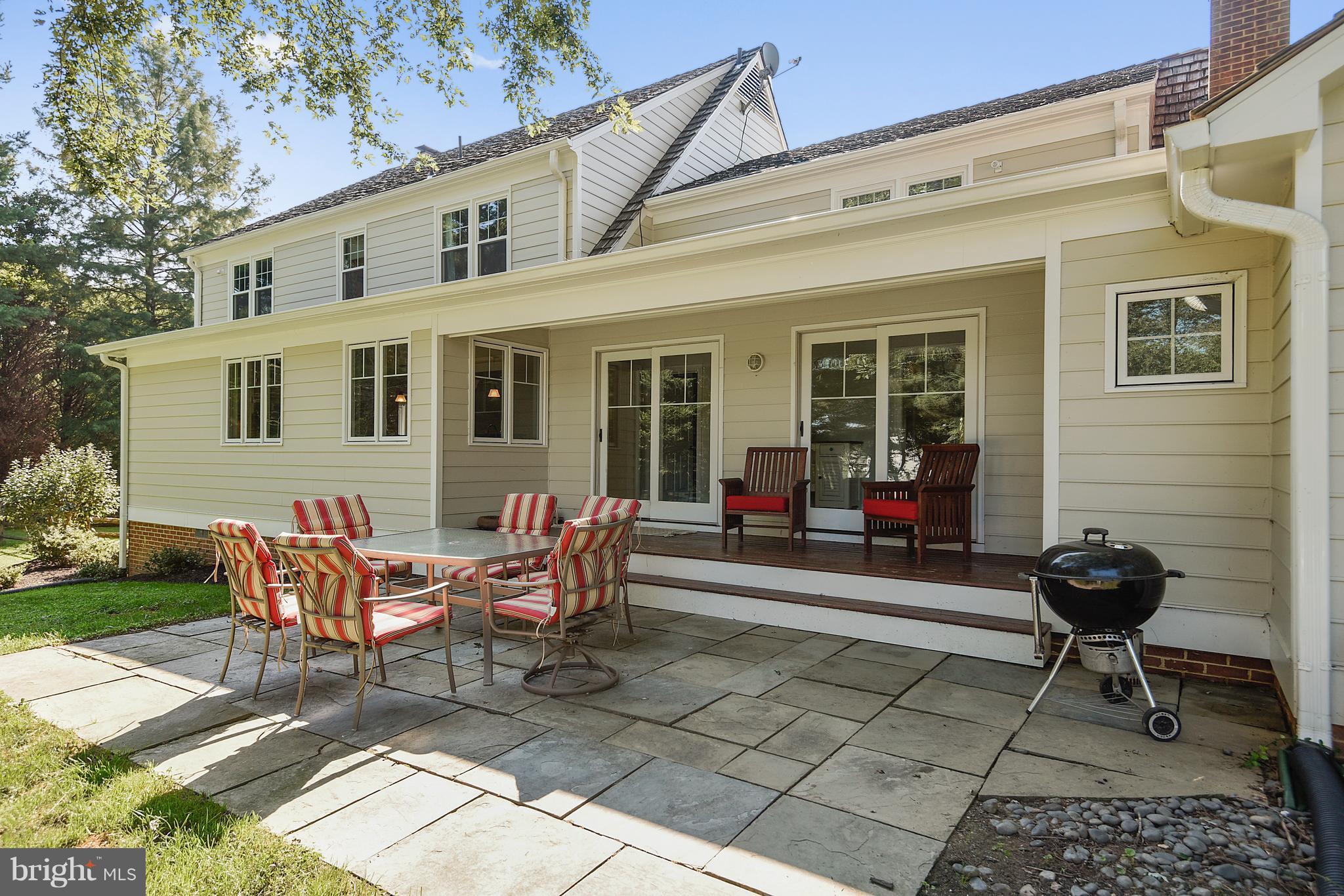 12408 Beall Spring Road Potomac, MD 20854 - Photo 23 of 30 a view of a house with backyard sitting area and garden
