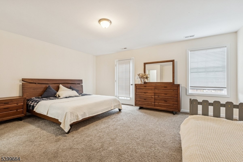 18 Joseph Drive, Unit 18 Newton, NJ 07860 - Photo 13 of 24 a bedroom with a bed a dresser and a window