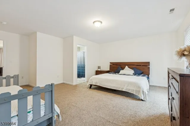 a bedroom with a bed and a table