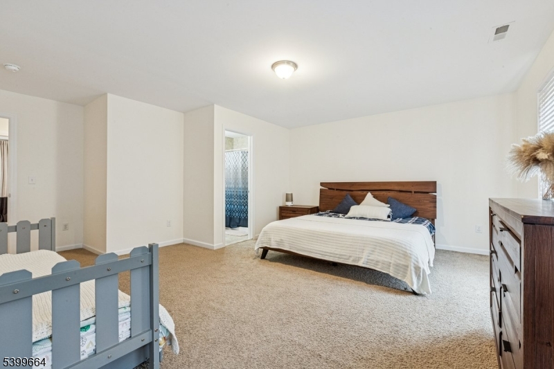 18 Joseph Drive, Unit 18 Newton, NJ 07860 - Photo 14 of 24 a bedroom with a bed and a table