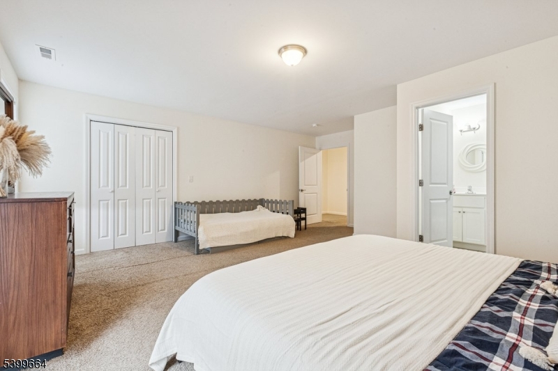 18 Joseph Drive, Unit 18 Newton, NJ 07860 - Photo 15 of 24 a spacious bedroom with a bed and a couch