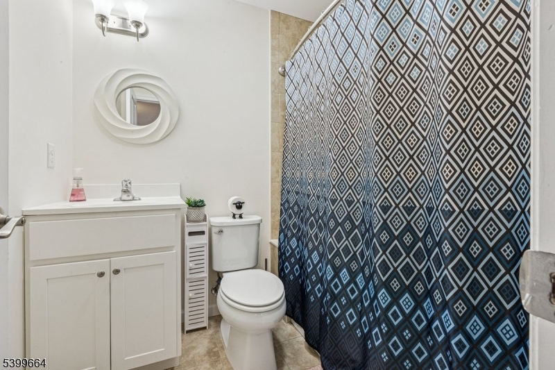 18 Joseph Drive, Unit 18 Newton, NJ 07860 - Photo 16 of 24 a bathroom with a sink a toilet and a mirror