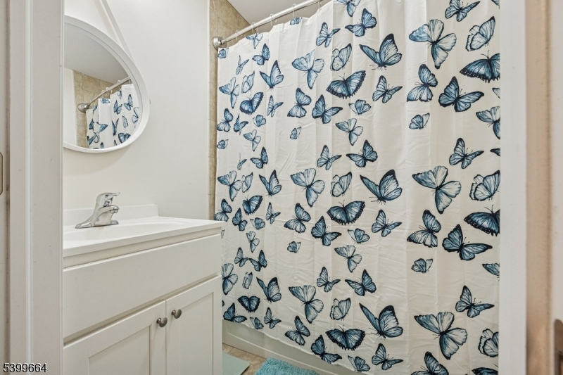 18 Joseph Drive, Unit 18 Newton, NJ 07860 - Photo 20 of 24 a bathroom with a shower curtain